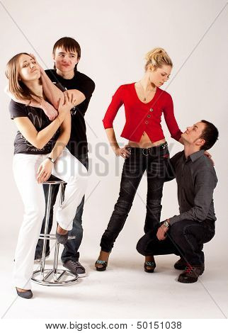 Two couples of teenagers in dorky mood