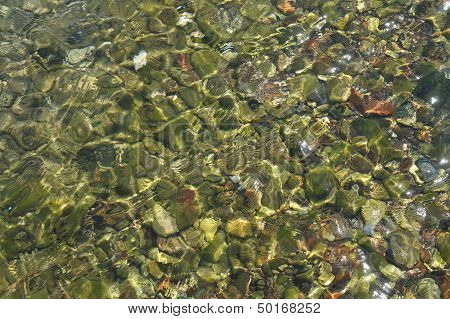 Clear sea water and stones