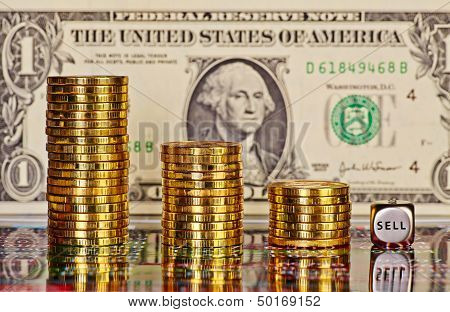 Downtrend Stacks Of Golden Coins, Dices Cube With The Word Sell And One Dollar Banknote As Backgroun