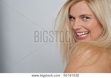 Flirtatious Nude Female Model Smiling At You