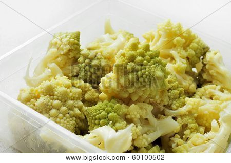 cooked romanesco broccoli in a plastic container