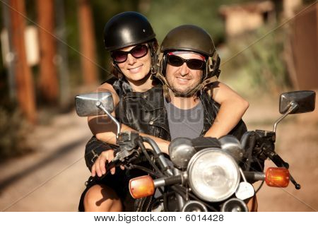 Man And Woman On Motorcycle