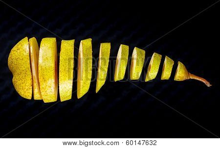 Fresh Pear Cut To Slices On Black Background