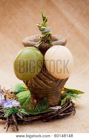 Two Shiny Easter Eggs With Ceramic Vase And Ornamental Wicker