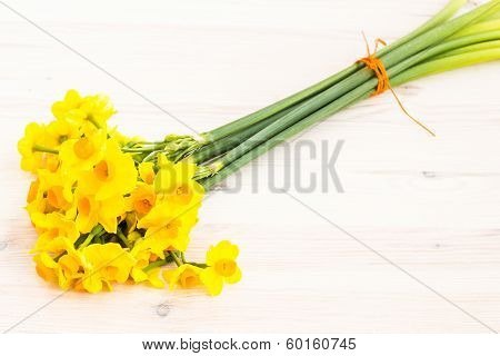 Bouqut Of Yellow Lent Lilyl (daffodil) On A Wooden Table