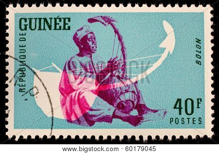 GUINEA CIRCA 1962: stamp printed by Guinea, shows Musical Instrument, Bolon, circa 1962 