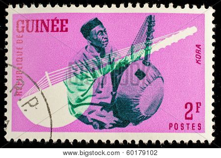 GUINEA CIRCA 1962: stamp printed by Guinea, shows Musical Instrument, Kora, circa 1962 