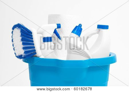 cleaning supplies in bucket on white background