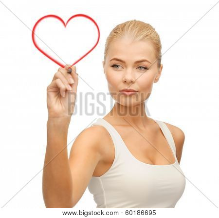 relationaship, love and happiness concept - portrait of woman in white shirt writing in the air