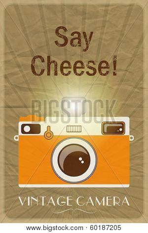 Retro photographic poster with the slogan Say Cheese!, on crumpled brown paper background. EPS10 vector format