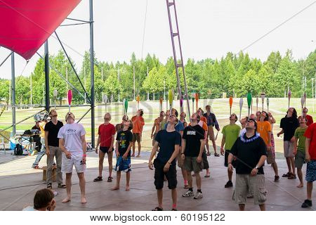 People Balance Juggling Clubs On Head
