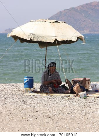 An old Turkish couple on the beach