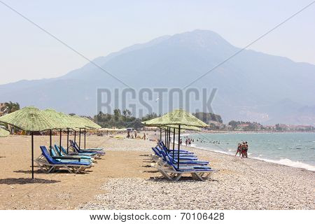 Tourists sunbathing on the beach