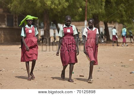 TORIT, SOUTH SUDAN-FEBRUARY 20 2013: Unidentified female students leave the primary school in Torit, South Sudan