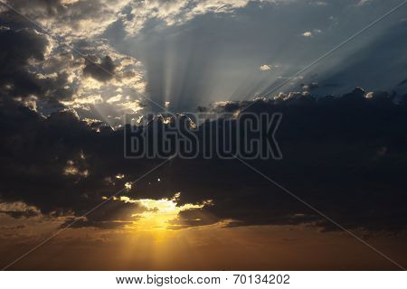 Cloudscape With The Sun Rays Radiating From Behind The Cloud