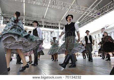 ZAGREB, CROATIA - JULY 19: Members of folk groups Nograd  from Salgotarjan, Hungary during the 48th International Folklore Festival in center of Zagreb, Croatia on July 19, 2014