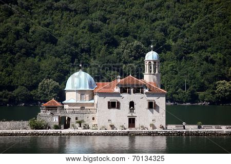 PERAST, MONTENEGRO - JUNE 08: Church of Our Lady of the Rocks. Our Lady of the Rocks is one of the two islets off the coast of Perast in Bay of Kotor, Montenegro, on Jun 08, 2012