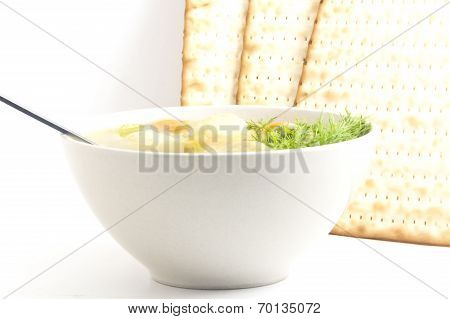 Delicious Matzoh ball soup with crackers wine and dill