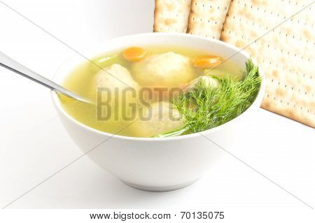 Delicious Matzoh ball soup with crackers wine and dill