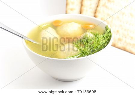 Delicious Matzoh ball soup with crackers wine and dill