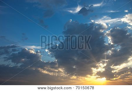 Cloudscape With The Sun Rays Radiating From Behind The Cloud