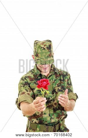 Military Officer Holding Flower Smiling Shy With Head Bowed