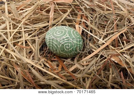 Easter egg on the straw. Easter concept.