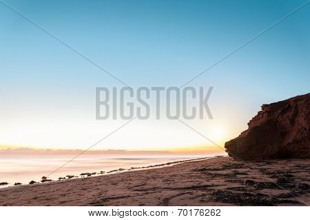 Red Sandstone Cliffs At Sunrise