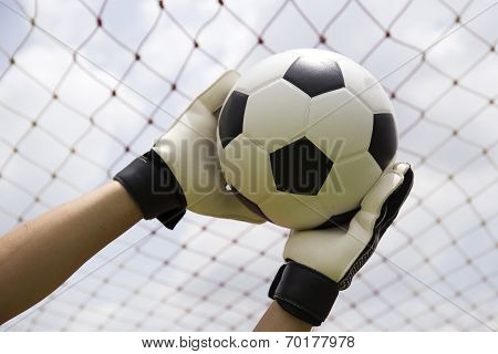 Goalkeeper's Hands Reaching Foot Ball