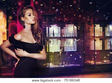 Fantasy. Beautiful Lady Over Shop Window With Jewels