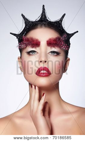 Fantasy. Styled Artistic Woman With Feather And Fantastic Hairstyle