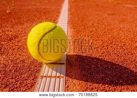 Yellow Tennis Ball Touching The Line