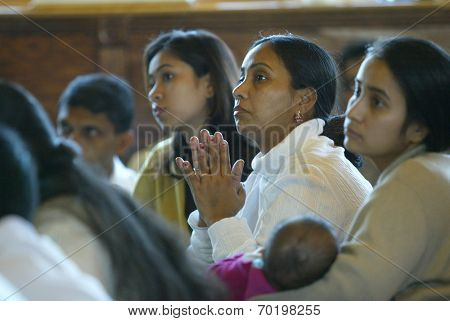 NEW YORK - JAN 1:  Rupali Barua (M), Papri Barua (L) and Shamali Barua (R) attend an interfaith ceremony at the Buddhist Vihara Temple to aid tsunami victims January 1, 2005 in Queens Village, NY.
