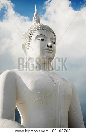 white buddha statue in the temple of Thailand