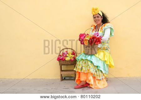 HAVANA, CUBA - JANUARY 8, 2015 : Young latin woman wearing a traditional dress in Old Havana