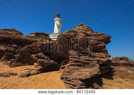 Lighthouse And Rocks