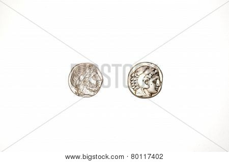 Two Ancient Silver Coins On White Background