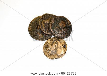 Four Old Bronze Coins On White Background