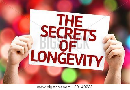 The Secrets of Longevity card with colorful background with defocused lights