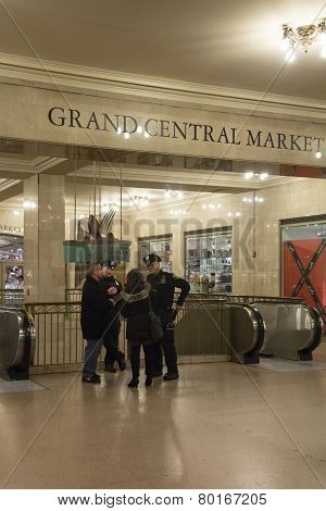 Police Officers Assist Tourist At Grand Cetral Terminal