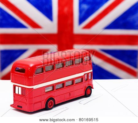 A Red Double Decker Bus And Flag