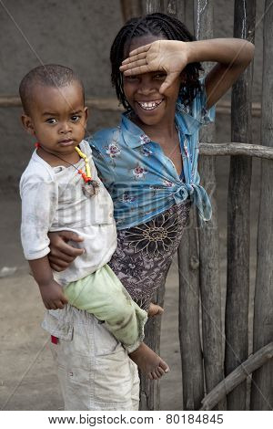 Portrait Of The African Girl With Litlle Boy.