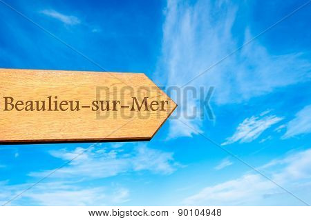 Wooden arrow sign pointing touristic destination