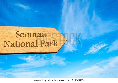 Wooden arrow sign pointing touristic destination