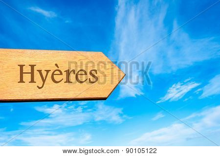 Wooden arrow sign pointing touristic destination