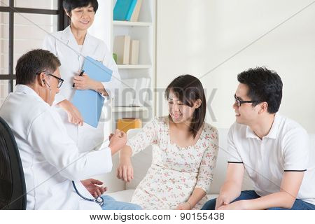 Asian couple consult doctor. Woman health concept.