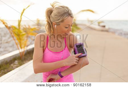 Woman using sports tracking mobile app on her smartphone