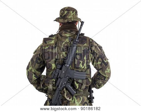 Soldier In Camouflage And Modern Weapon M4.