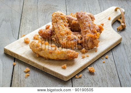 Banana Frield With Wood Block On Wood Board Background