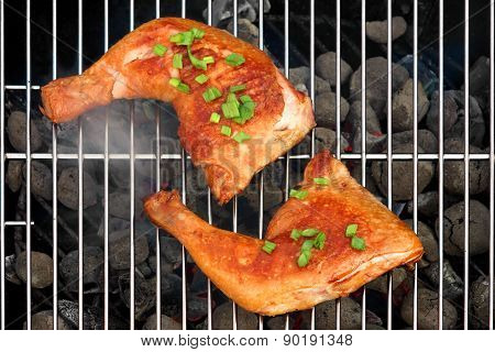 Two Bbq Roast Chicken Quarters On The Hot Charcoal Grill